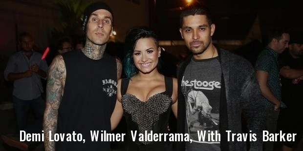  demi lovato , wilmer valderrama, and super awesome drummer travis barker, 