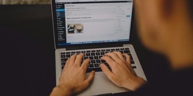 20151201192209 blogging typing wordpress macbook laptop computer technology business marketing working creative writing office desk hands remote worker startup