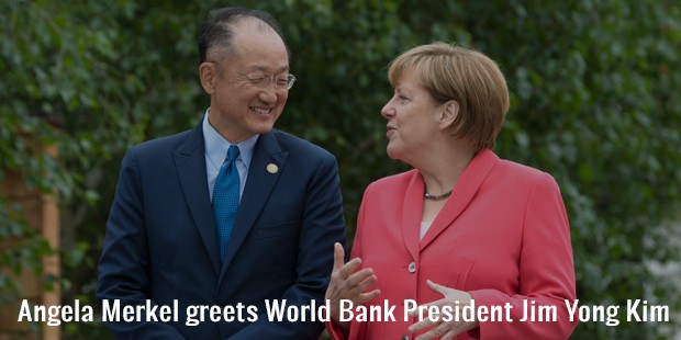 angela merkel greets world bank president jim yong kim