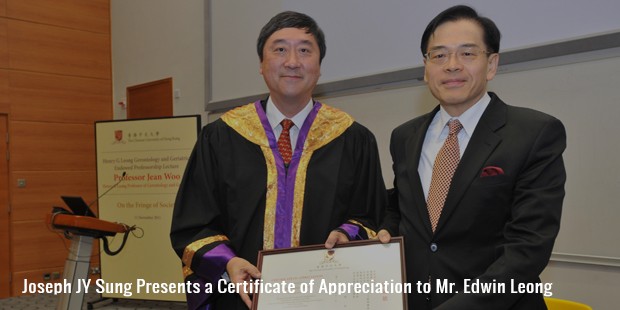 joseph jy sung presents a certificate of appreciation to mr