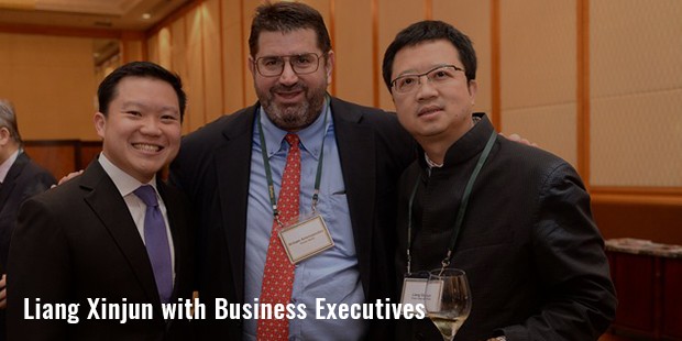 liang xinjun with business executives