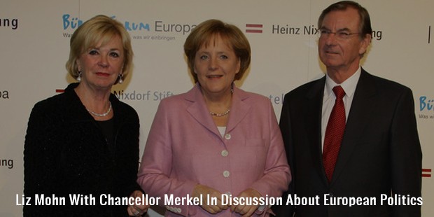 liz mohn with chancellor merkel in discussion about european politics