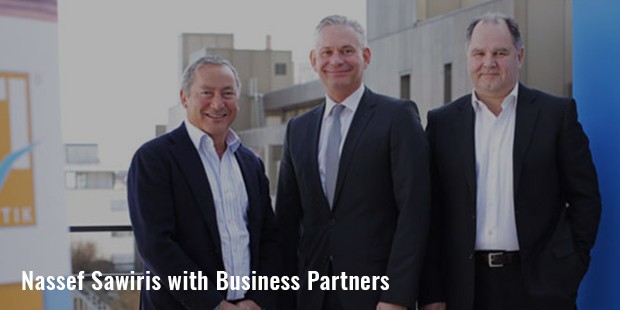 nassef sawiris with business partners