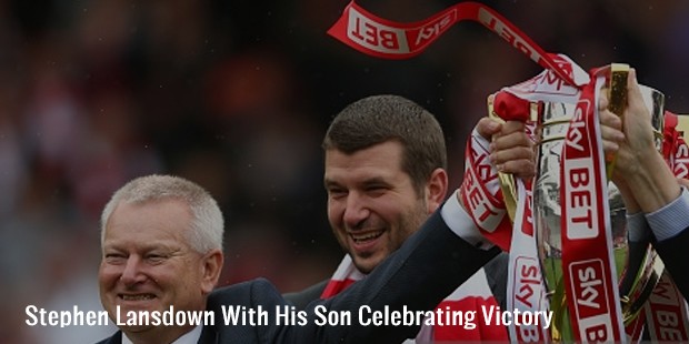 stephen lansdown with his son celebrating victory