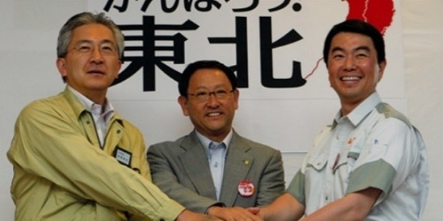 akio toyoda, center, poses with iwate governor takuya tasso, left, and miyagi