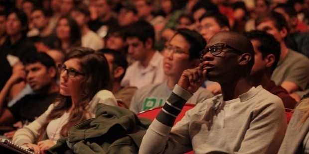 audience listening to public speaker 