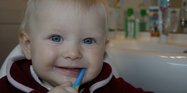 child brushing teeth