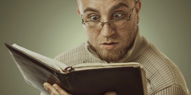 confused man reading book