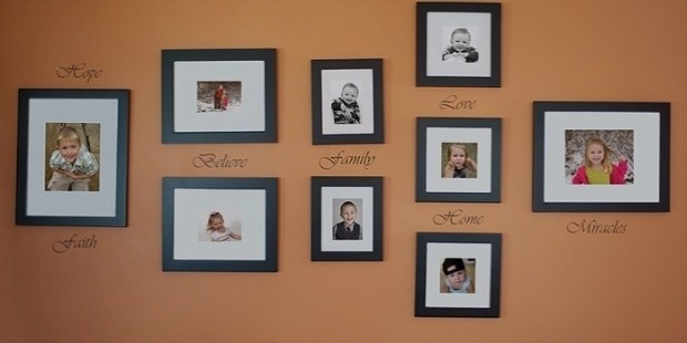 group of arranged photos hung on a large wall