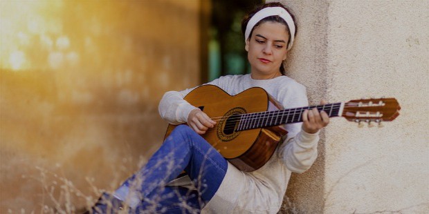 guitar playing woman