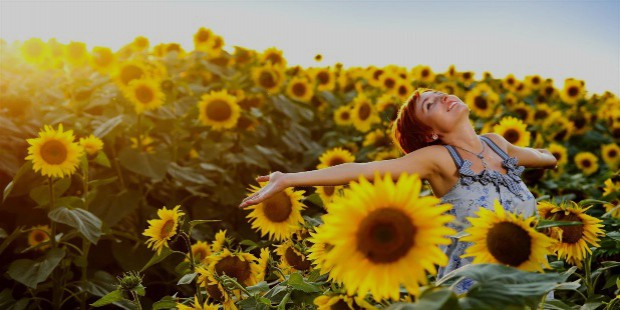 happy girl in field of flowers