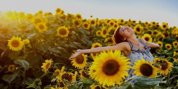 happy girl in field of flowers