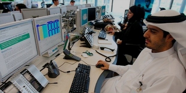 international employees of standard chartered work at the new trading room in dubai international financial centre