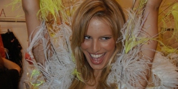 karolina kurkova celebrated in her feathered getup while backstage in 2002