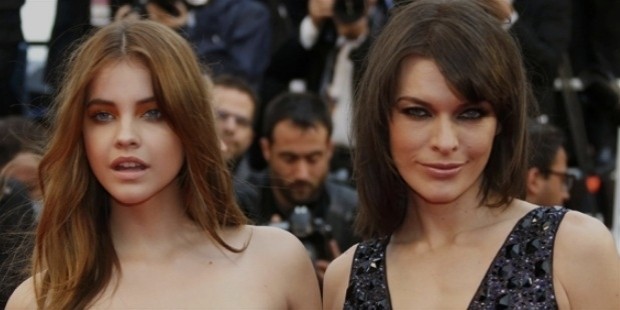 model barbara palvin  l  and actress milla jovovich pose on the red carpet