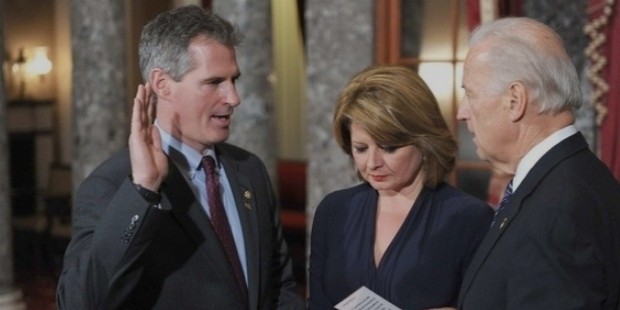 republican scott brown, accompanied by wife gail huff, is sworn in to the senate by vice president joe biden