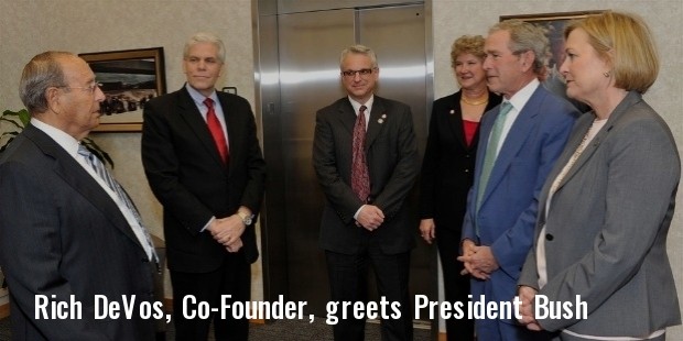rich devos, co founder, amway corporation, greets president bush