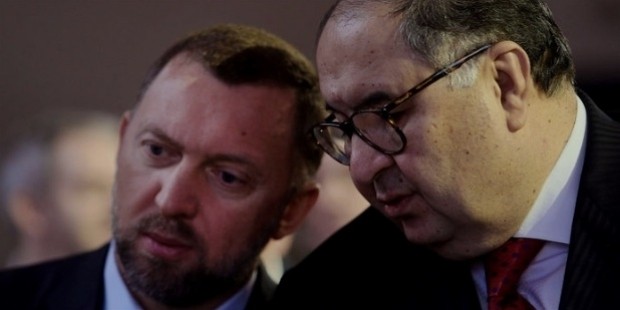 rusal, left, speaks with russian billionaire alisher usmanov, before the opening keynote speech on the first day of the world economic forum