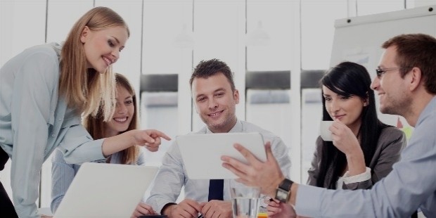 team sitting around a desk