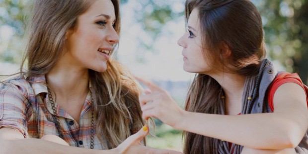 two young females talking to each other