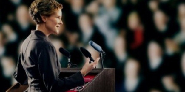 women speaking at podium