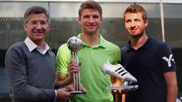 Thomas and his brother Simon with Adidas CEO Herbert Hainer
