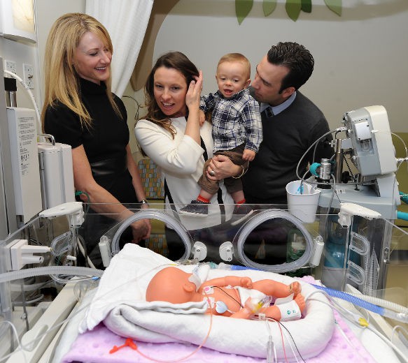 Heathe Edwards visits a family of child