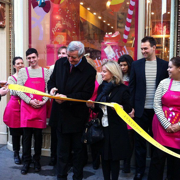 Reinold Geiger cutting the ribbon of first Flagship store, December 2011