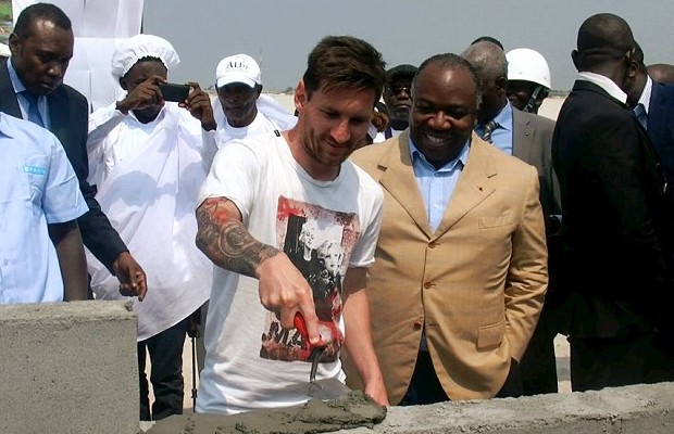Lionel Messi helps lay a stone at Port-Gentil stadium in Gabon alongside president Ali Bongo