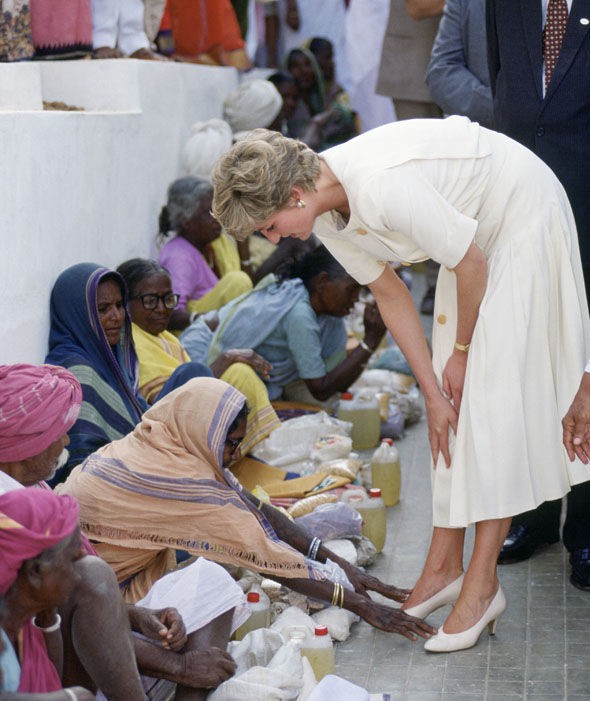 A woman touches Diana's feet at Mianpur Old Age Welfare Centre In Hyderabad, India