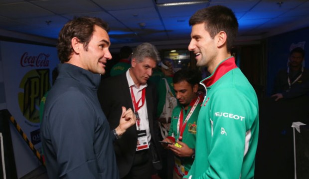 Federer having a chat with Djokovic