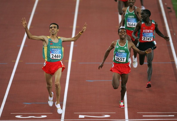 Hicham El Guerrouj after crossing finish line at Athens Olympics in 2004