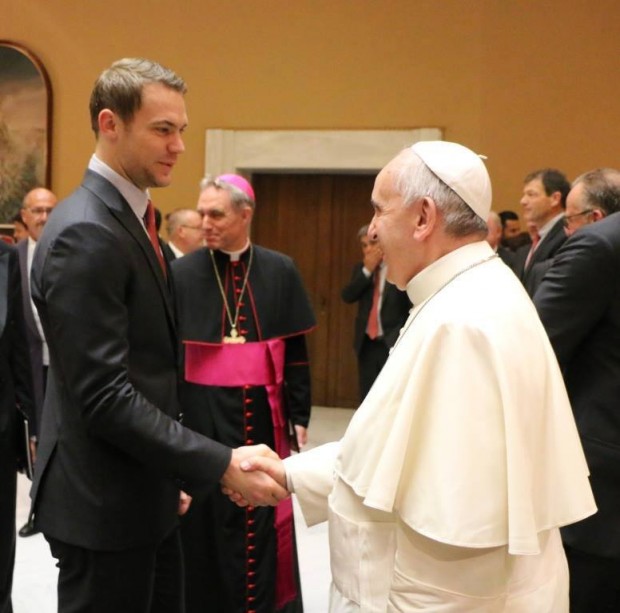 Manuel Neuer shaking hands with Pope Francis