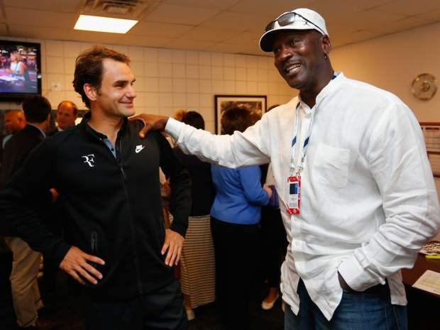 Jordan having a conversation with Roger Federer