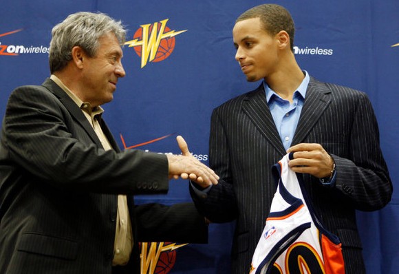 Stephen Curry, left, with Larry Riley