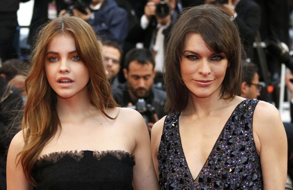 Model Barbara Palvin (L) and actress Milla Jovovich pose on the Red Carpet