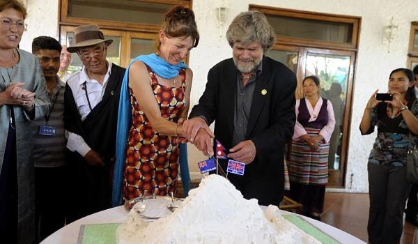 Italian Reinhold Messner and New Zealander Lydia Bradey Cutting Cake