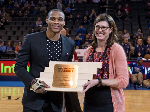 Russell Westbrook holding his Community Assist Shield