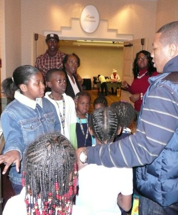 Ray having a chat with kids at holiday party
