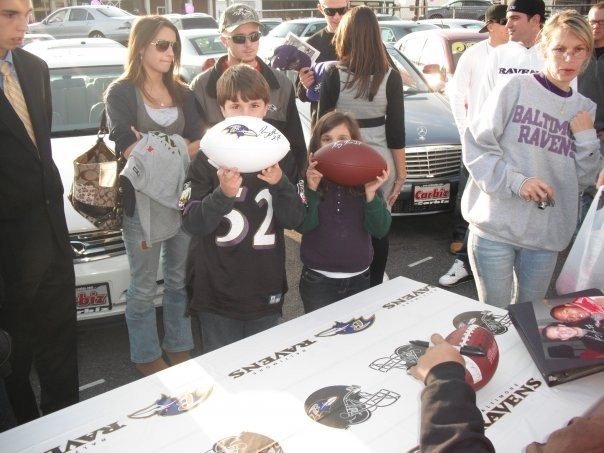 Kids with Ball Signed by Ray Rice