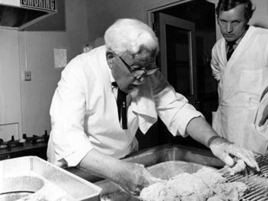 Sanders in Making Fried Chicken